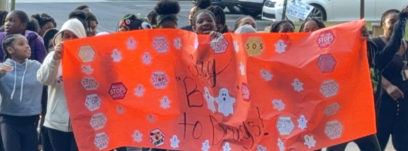 5th Grade Students holding banner during Red Ribbon Week Parade 